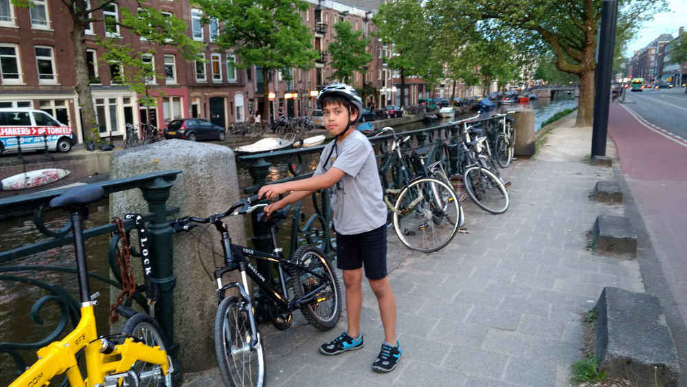 Apik with his kids bike in the Netherlands